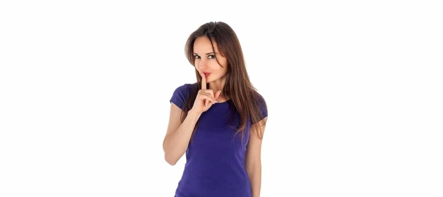 Woman with finger to lips